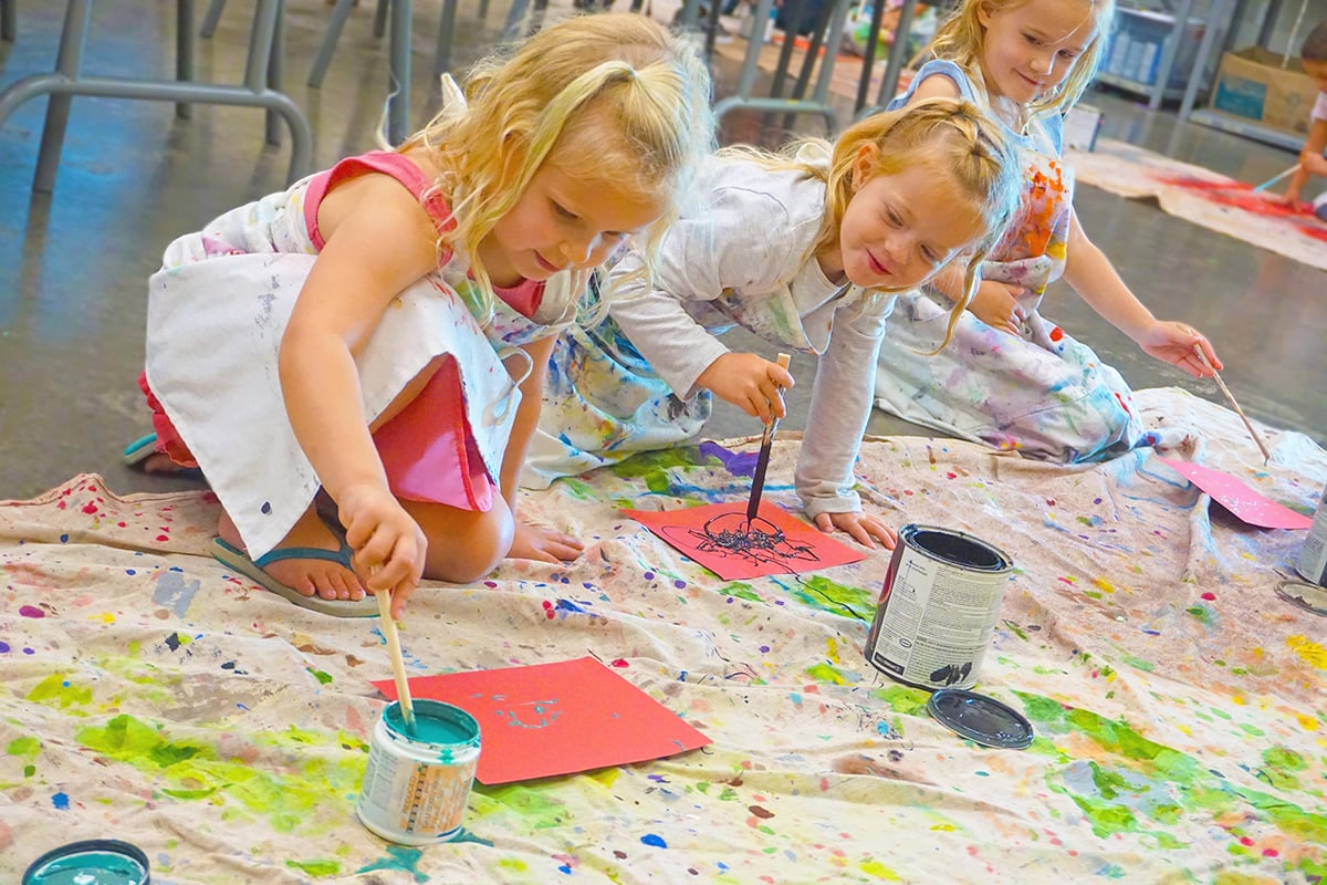 Children painting and creating art at Hawaii Rainbow Children's Art Training Center